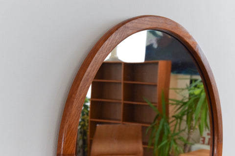This beautifully modest 1960s teak mirror is the perfect piece to inject some retro charm to your home. The clean lines, simple round shape and rich wooden frame really give this mirror an effortless elegance which is sure to look lovely in any room of the house.
In nice condition for its age with the usual light surface wear commensurate with age including marks and dints to the frame. 