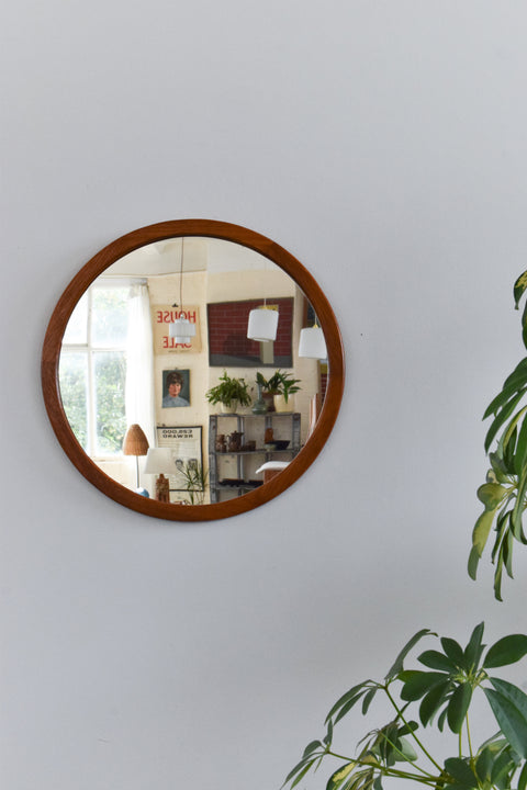 This beautifully modest 1960s teak mirror is the perfect piece to inject some retro charm to your home. The clean lines, simple round shape and rich wooden frame really give this mirror an effortless elegance which is sure to look lovely in any room of the house.
In nice condition for its age with the usual light surface wear commensurate with age including marks and dints to the frame. 