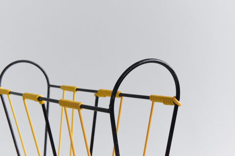 Vintage Black and Yellow Metal and Plastic Magazine Rack