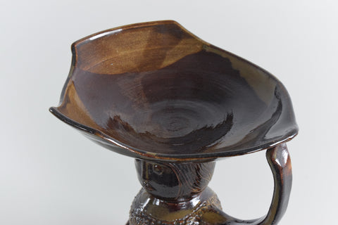 Whether for use as a fruit bowl, candle holder, or a handy catch all this striking piece is sure to look great in any home.