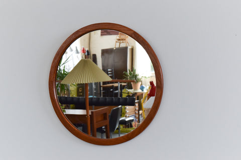 This beautifully modest 1960s teak mirror is the perfect piece to inject some retro charm to your home. The clean lines, simple round shape and rich wooden frame really give this mirror an effortless elegance which is sure to look lovely in any room of the house.&nbsp;

In nice condition for its age with the usual light surface wear commensurate with age including marks and dints to the frame.&nbsp;