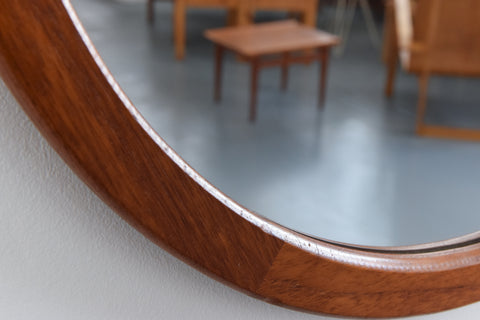 This beautifully modest 1960s teak mirror is the perfect piece to inject some retro charm to your home. The clean lines, simple round shape and rich wooden frame really give this mirror an effortless elegance which is sure to look lovely in any room of the house.&nbsp;

In nice condition for its age with the usual light surface wear commensurate with age including marks and dints to the frame.&nbsp;